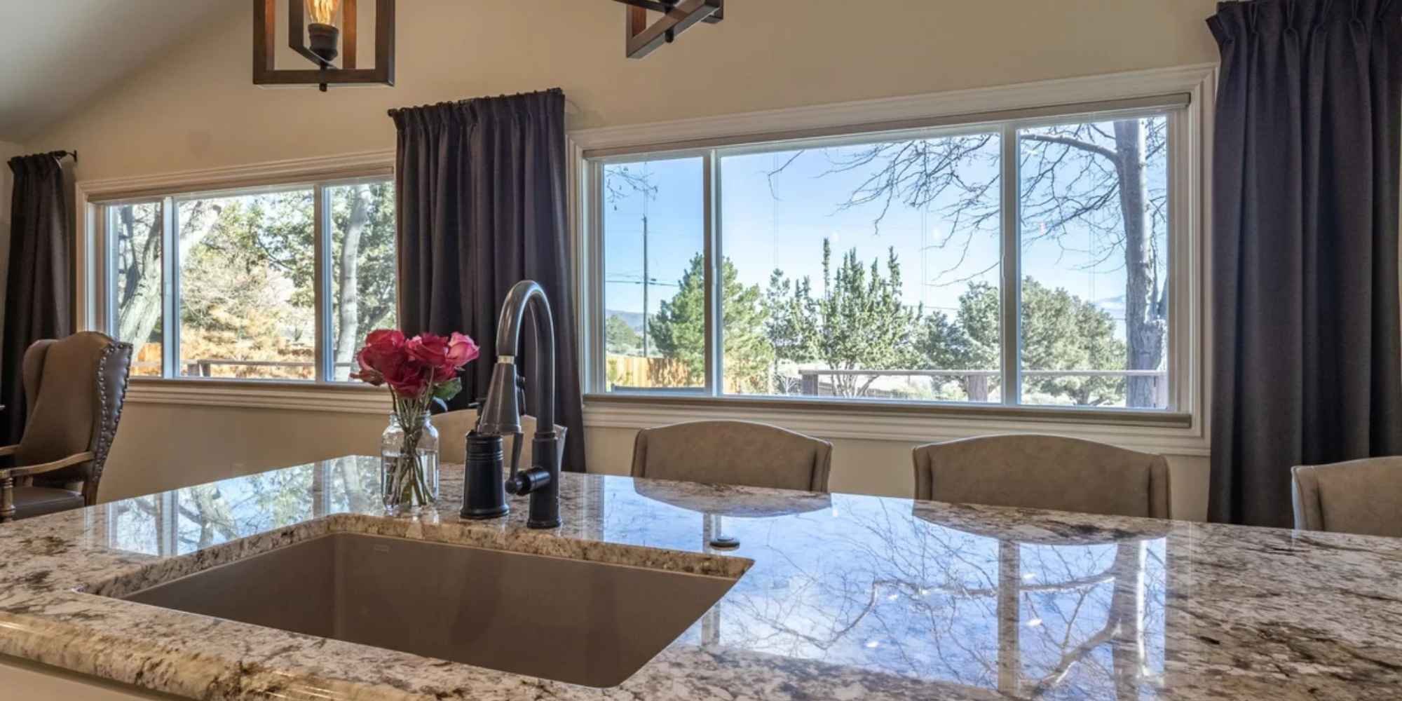 Image of a kitchen remodel with extended counter and updated windows by M and G construction in Reno, NV