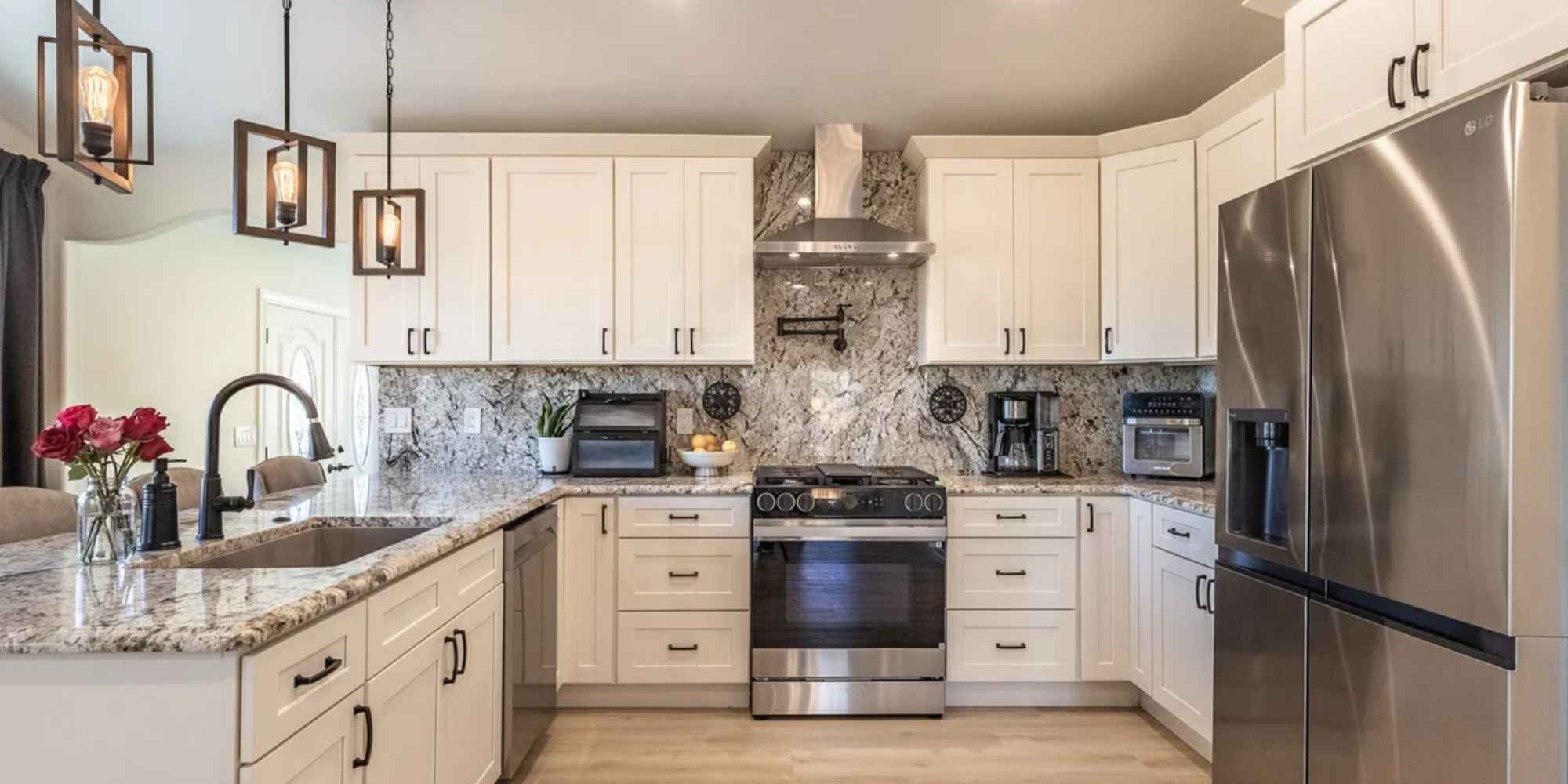Image of a remodeled kitchen with updated appliances, backsplash, counters, and cabinets by M&G Construction