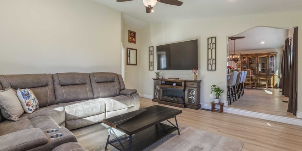 Image of a great room remodel with wood flooring and arch doorway in Reno, NV by M&G Construction
