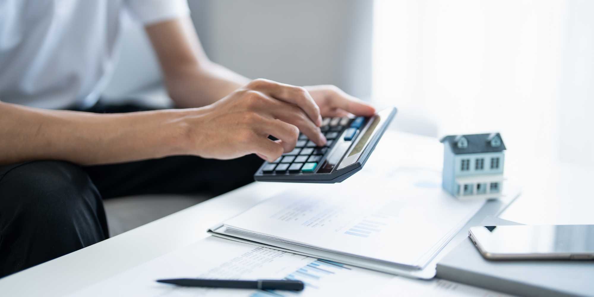 Stock image of a person calculating their personal loan in Reno, NV for the home remodel