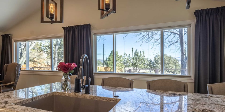 Image of a kitchen remodel with on-island sink and windows for natural light by M&G Construction in Reno, NV