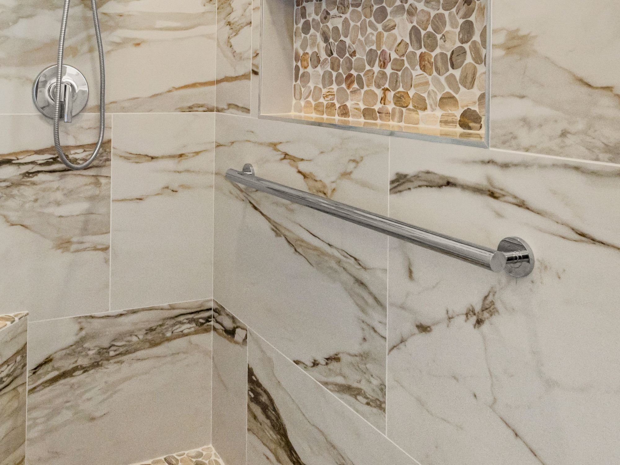 Grab bar in a walk-in shower as part of a primary bathroom remodel in Northwest Reno by M&G Construction Grab bar in a walk-in shower as part of a primary bathroom remodel in Northwest Reno by M&G Construction