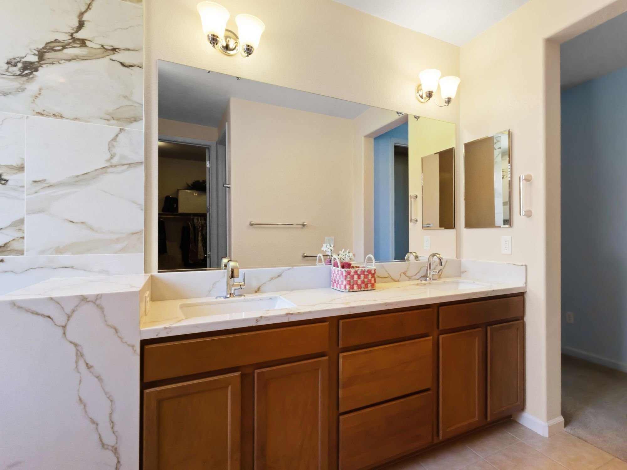 Primary bathroom remodel in Northwest Reno featuring quartz countertops, marble-look tile, and a double-sink vanity by M&G Construction Primary bathroom remodel in Northwest Reno featuring quartz countertops, marble-look tile, and a double-sink vanity by M&G Construction